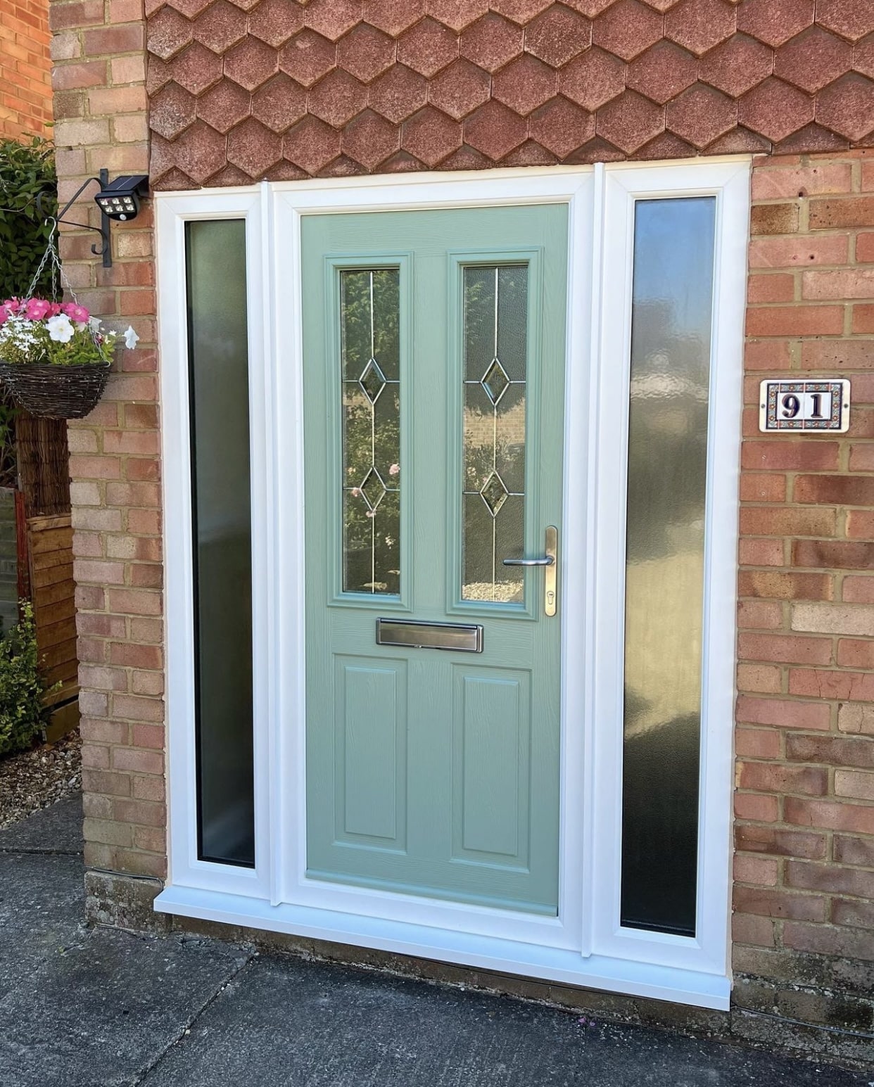 Green Comp Door front door with decorative glass and glazed side panels